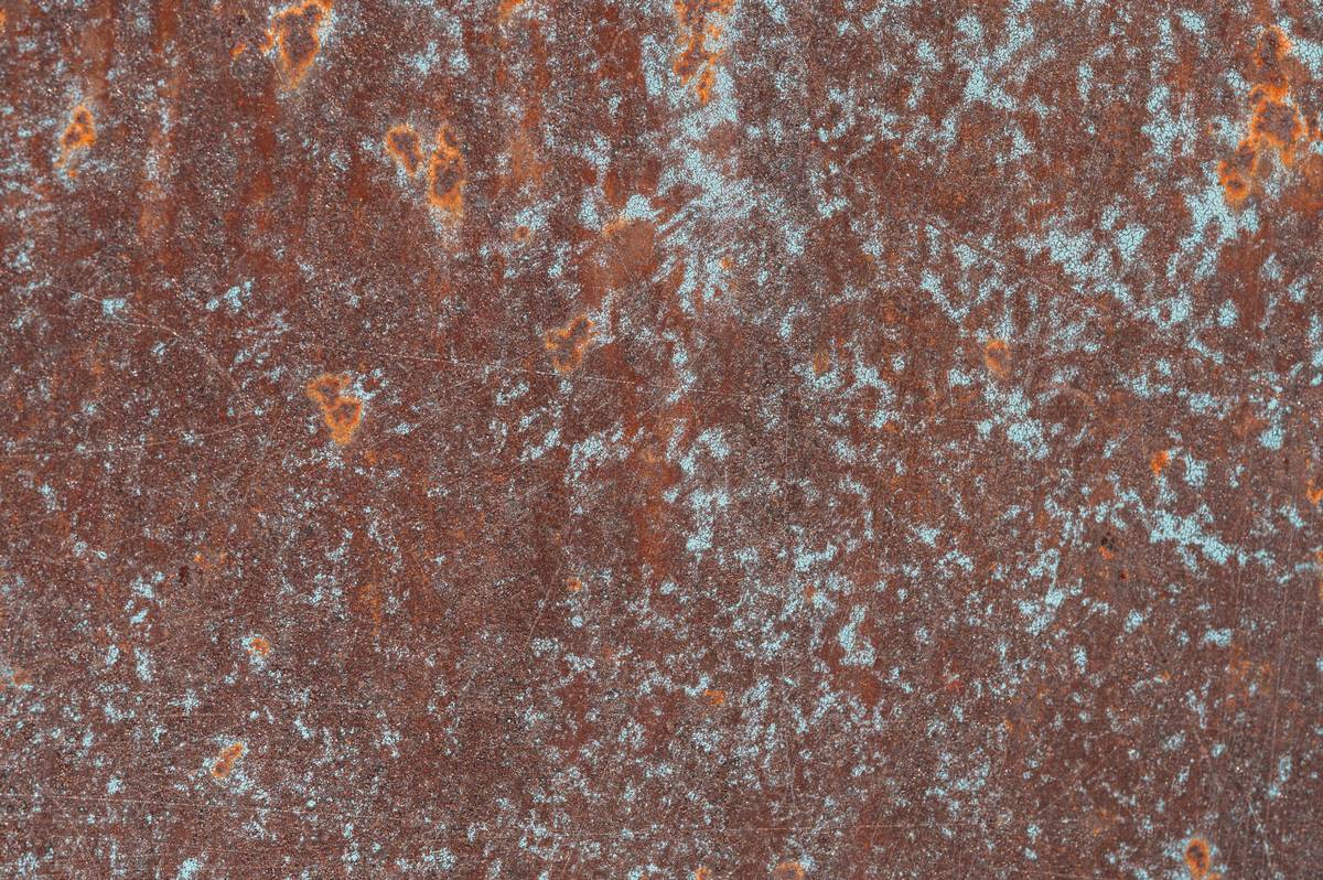 Before and after comparison showing green rust on metal removed naturally