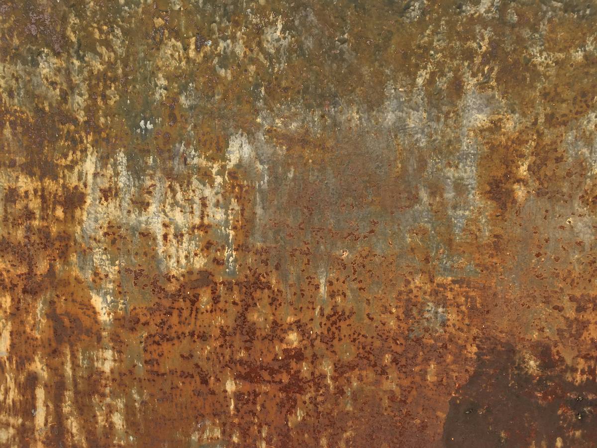 rust of green gram applied to rusty wrench showing before and after results